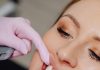What to Expect Out of Veneer Implants Dentist fitting a patient with porcelain veneer implants